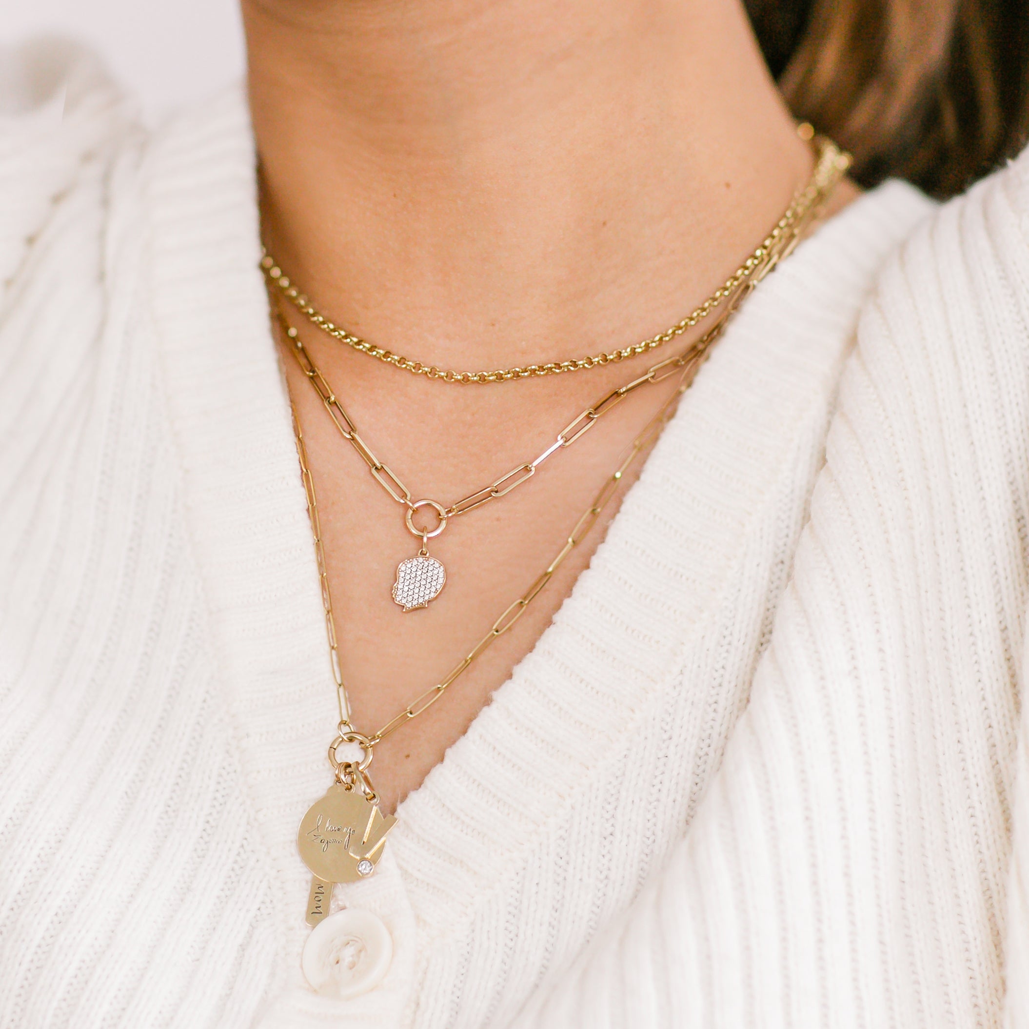 Pave Diamond Silhouette Charm layered with other necklaces